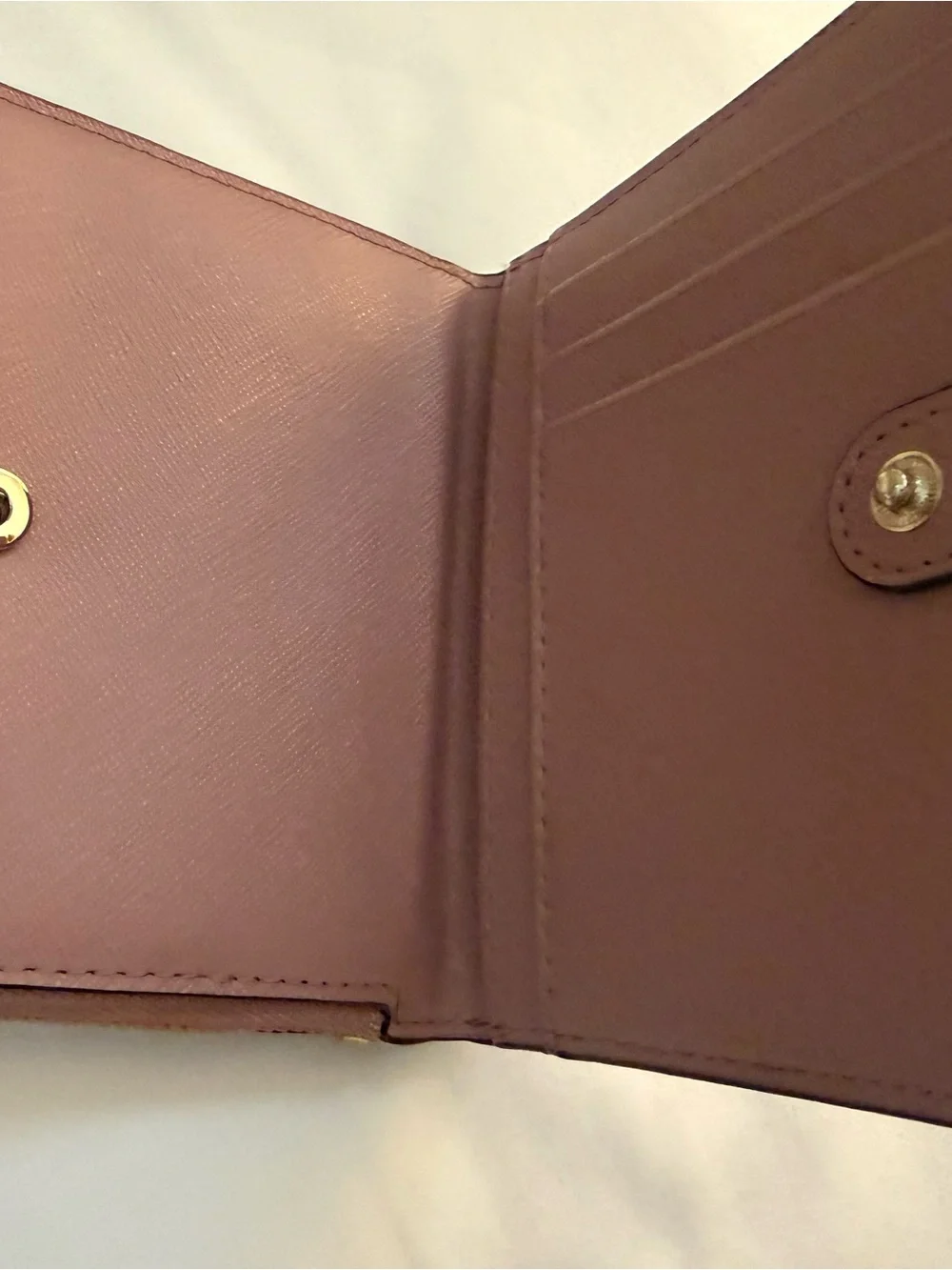 kate spade mauve pink leather zip wallet with gold plaque
